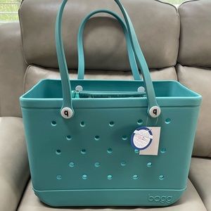 Turquoise and Caicos new with tags large Bogg bag.